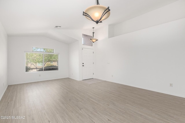 13140 E Mesquite Flat Spring Dr, Vail, AZ 85641 - unfurnished room featuring light wood-type flooring and lofted ceiling