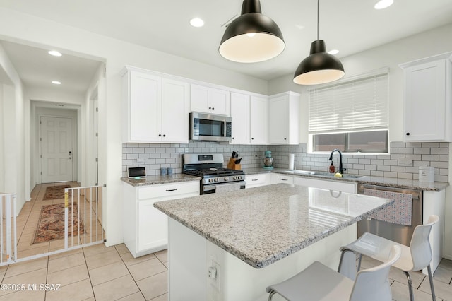 6548 E Via Arroyo Largo, Tucson, AZ 85756 - kitchen featuring appliances with stainless steel finishes, a sink, decorative backsplash, white cabinets, and recessed lighting