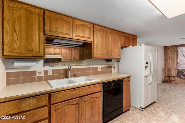 423 E Hadley St, Tucson, AZ 85705 - kitchen featuring a sink, black dishwasher, brown cabinets, white fridge with ice dispenser, and light countertops