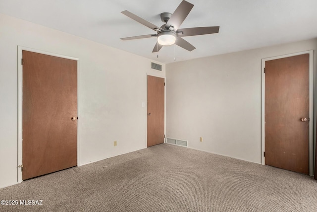 423 E Hadley St, Tucson, AZ 85705 - unfurnished bedroom with carpet, visible vents, and ceiling fan