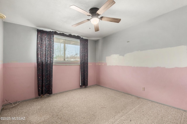 423 E Hadley St, Tucson, AZ 85705 - carpeted spare room with a ceiling fan