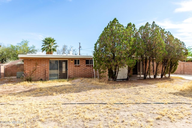 423 E Hadley St, Tucson, AZ 85705 - back of house with brick siding and fence