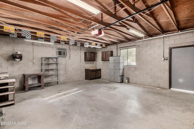 423 E Hadley St, Tucson, AZ 85705 - below grade area with a garage and concrete block wall