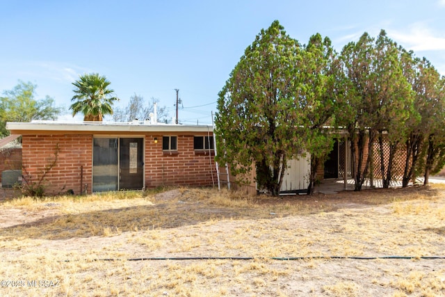 423 E Hadley St, Tucson, AZ 85705 - back of house with brick siding