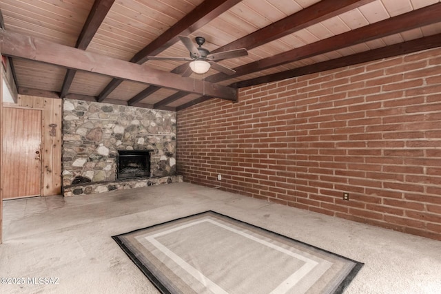 423 E Hadley St, Tucson, AZ 85705 - unfurnished living room featuring beam ceiling, wooden ceiling, ceiling fan, carpet flooring, and a stone fireplace