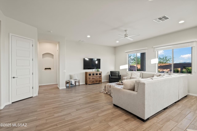 7797 S Indian Wheat Way, Tucson, AZ 85747 - living area with light wood-style floors, ceiling fan, recessed lighting, and baseboards