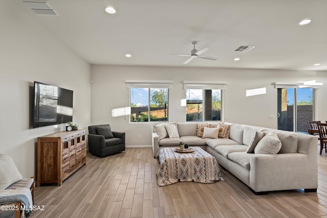 7797 S Indian Wheat Way, Tucson, AZ 85747 - living area featuring light wood-style floors, ceiling fan, recessed lighting, and baseboards