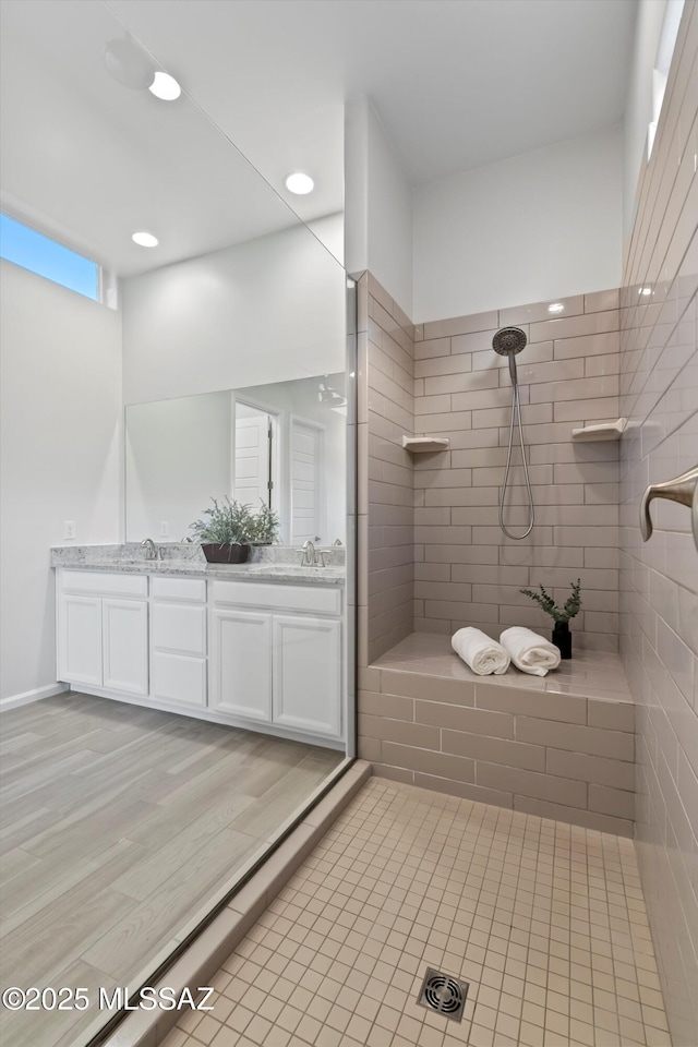 7797 S Indian Wheat Way, Tucson, AZ 85747 - full bathroom featuring tiled shower, double vanity, recessed lighting, and wood finished floors