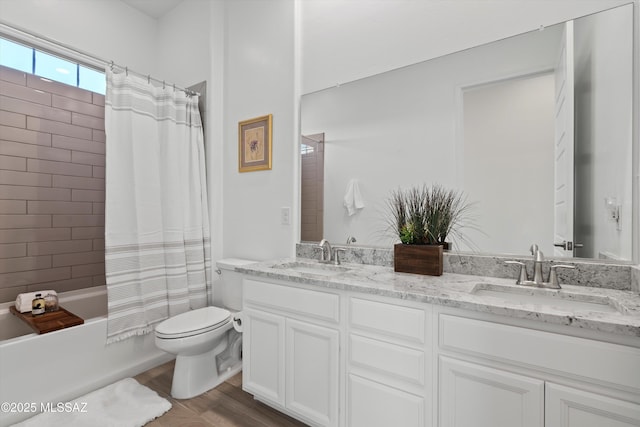 7797 S Indian Wheat Way, Tucson, AZ 85747 - bathroom with double vanity, toilet, wood finished floors, and shower / bathtub combination with curtain