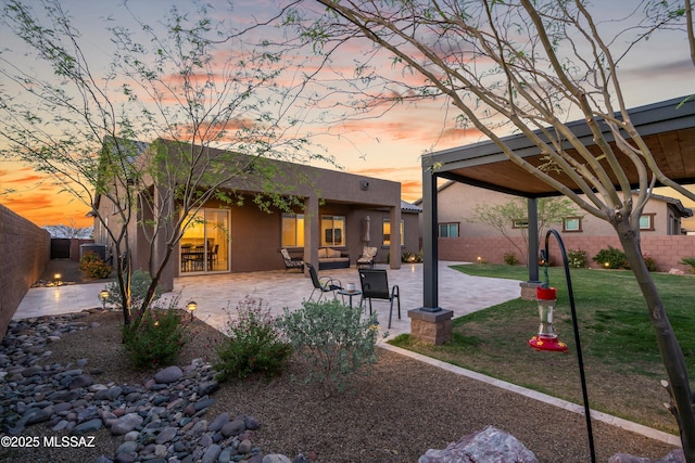 7797 S Indian Wheat Way, Tucson, AZ 85747 - rear view of house featuring stucco siding and a patio area