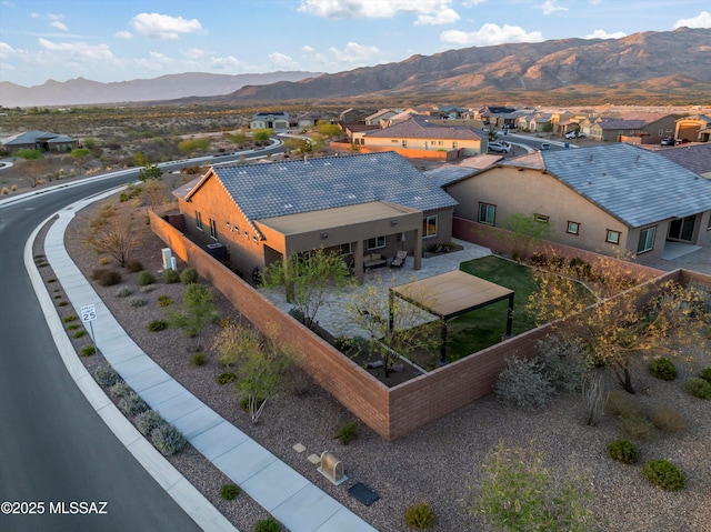 birds eye view of property featuring a mountain view and a residential view
