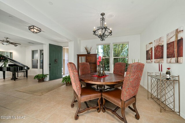 12487 N Wind Runner Pkwy, Marana, AZ 85658 - dining area featuring light tile patterned floors, a chandelier, and baseboards