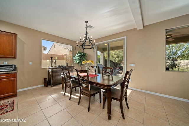 12487 N Wind Runner Pkwy, Marana, AZ 85658 - dining area featuring a chandelier, light tile patterned floors, baseboards, and beamed ceiling