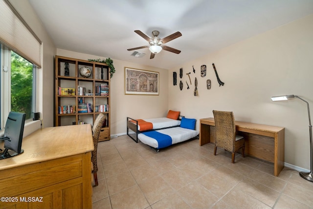 12487 N Wind Runner Pkwy, Marana, AZ 85658 - bedroom featuring a desk, light tile patterned floors, baseboards, and ceiling fan