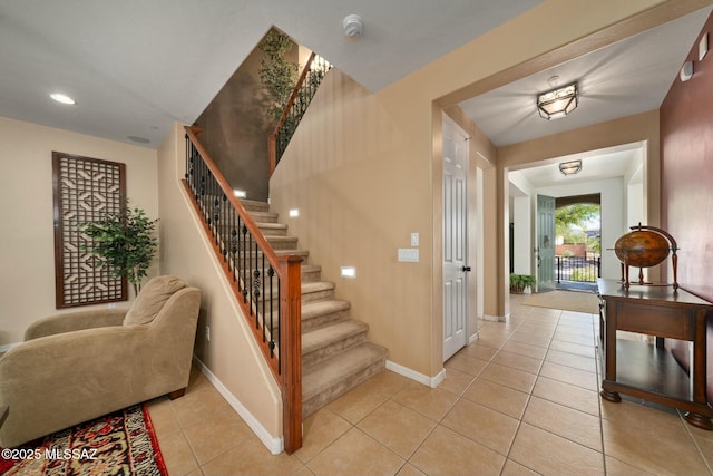 12487 N Wind Runner Pkwy, Marana, AZ 85658 - stairs with tile patterned floors, baseboards, and recessed lighting