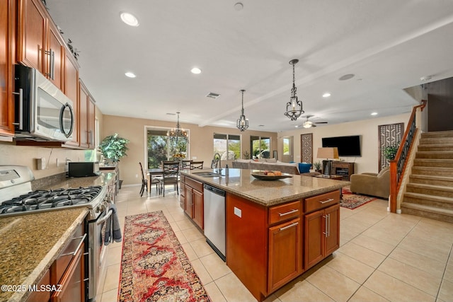 12487 N Wind Runner Pkwy, Marana, AZ 85658 - kitchen featuring appliances with stainless steel finishes, a chandelier, a sink, recessed lighting, and brown cabinets