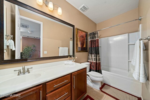 12487 N Wind Runner Pkwy, Marana, AZ 85658 - full bath featuring toilet, tile patterned floors, vanity, and shower / bath combo with shower curtain