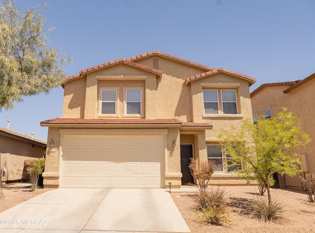 10391 E Malta St, Tucson, AZ 85747 - traditional-style home with a garage, stucco siding, and driveway