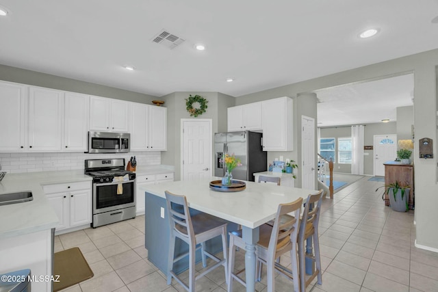 10391 E Malta St, Tucson, AZ 85747 - kitchen featuring light tile patterned flooring, appliances with stainless steel finishes, a sink, light countertops, and visible vents