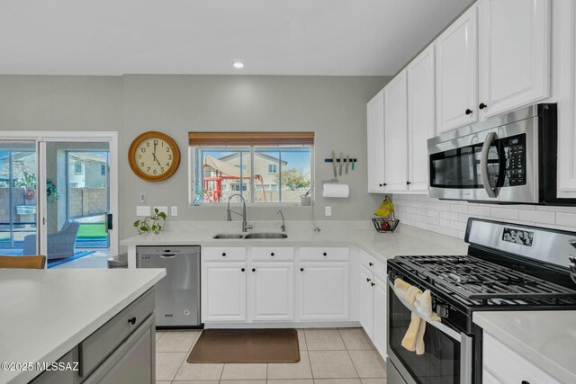 10391 E Malta St, Tucson, AZ 85747 - kitchen featuring a sink, white cabinetry, a healthy amount of sunlight, and stainless steel appliances