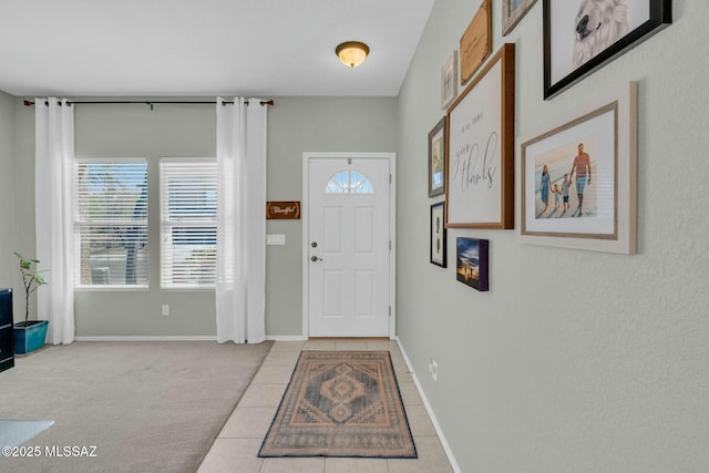 10391 E Malta St, Tucson, AZ 85747 - foyer with baseboards, plenty of natural light, and tile patterned floors