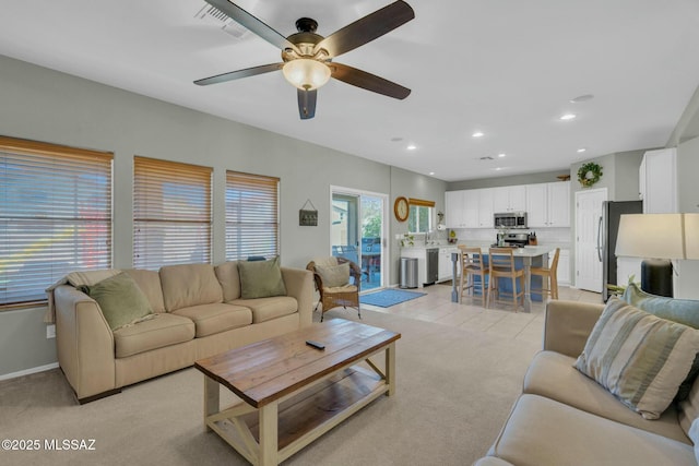 10391 E Malta St, Tucson, AZ 85747 - living area featuring recessed lighting, ceiling fan, light colored carpet, and visible vents