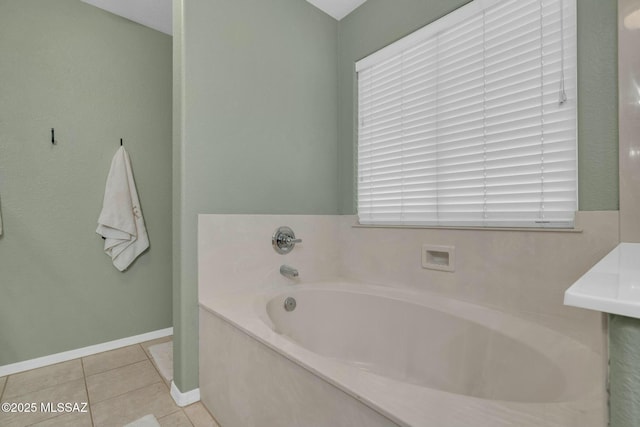 10391 E Malta St, Tucson, AZ 85747 - bathroom with tile patterned flooring, baseboards, and a bath
