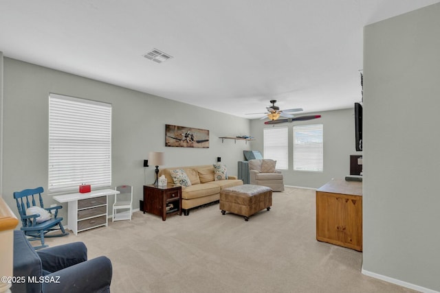 10391 E Malta St, Tucson, AZ 85747 - living area with ceiling fan, light colored carpet, and visible vents