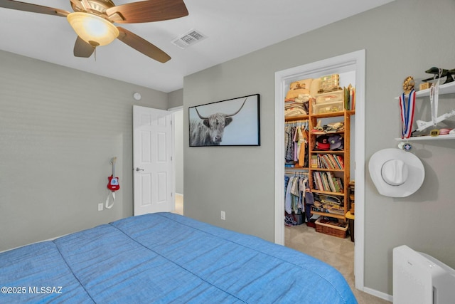 10391 E Malta St, Tucson, AZ 85747 - bedroom featuring visible vents, a closet, a walk in closet, ceiling fan, and carpet