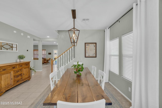10391 E Malta St, Tucson, AZ 85747 - dining space with visible vents, stairs, light tile patterned flooring, and a wealth of natural light