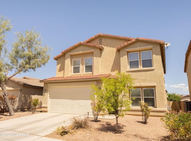 10391 E Malta St, Tucson, AZ 85747 - view of front of home with a tiled roof, an attached garage, driveway, and stucco siding
