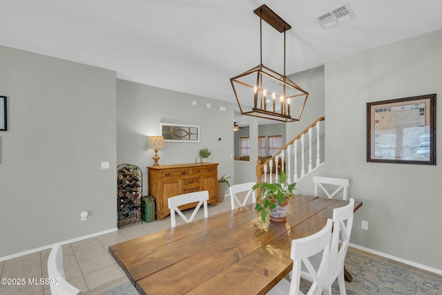 10391 E Malta St, Tucson, AZ 85747 - dining area featuring light tile patterned floors, baseboards, stairs, and visible vents