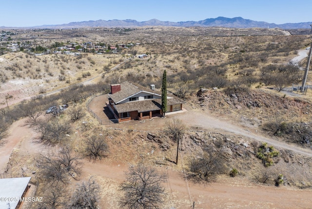 drone / aerial view with a mountain view and view of desert