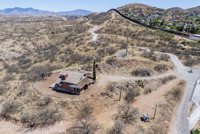 birds eye view of property with a mountain view