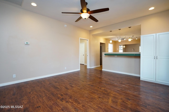 unfurnished living room with baseboards, recessed lighting, dark wood-type flooring, visible vents, and ceiling fan