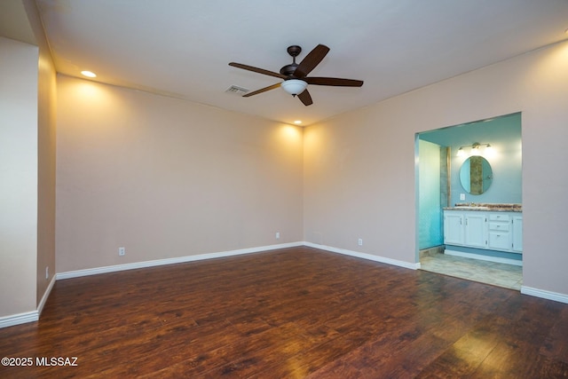 spare room with ceiling fan, visible vents, recessed lighting, wood finished floors, and baseboards