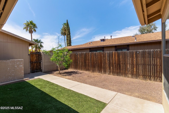 view of yard with a gate and fence