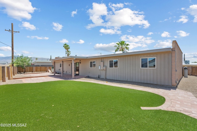 3216 S Winona Cir, Tucson, AZ 85730 - rear view of house with a patio and board and batten siding