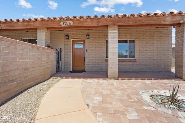 3216 S Winona Cir, Tucson, AZ 85730 - property entrance with brick siding and a gate