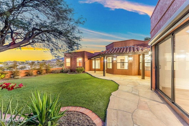 5788 E Paseo Cimarron, Tucson, AZ 85750 - yard at dusk with a lawn and a patio