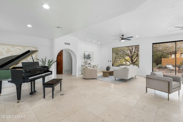 5788 E Paseo Cimarron, Tucson, AZ 85750 - living area with ceiling fan, arched walkways, recessed lighting, healthy amount of natural light, and light tile patterned floors