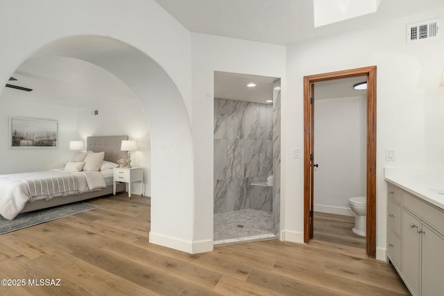 5788 E Paseo Cimarron, Tucson, AZ 85750 - ensuite bathroom with a marble finish shower, vanity, and wood finished floors