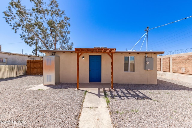 407 E 35th St, Tucson, AZ 85713 - view of front facade featuring a patio area, a fenced backyard, a pergola, and stucco siding