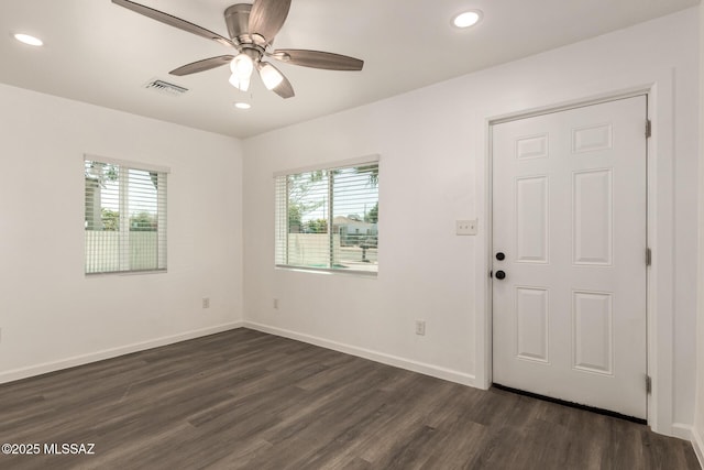 407 E 35th St, Tucson, AZ 85713 - empty room featuring recessed lighting, a healthy amount of sunlight, and dark wood-style flooring