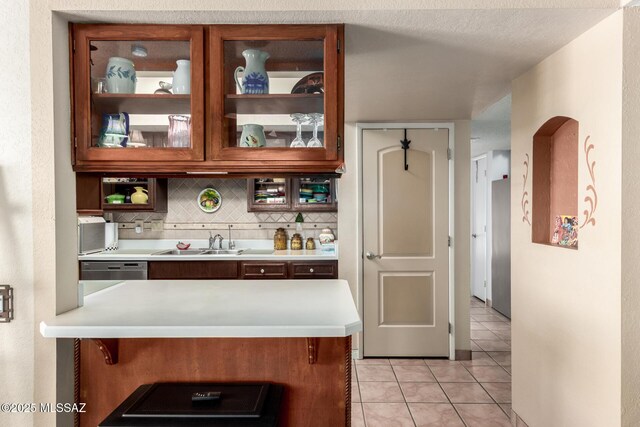 1379 W Camino Lucientes, Green Valley, AZ 85622 - kitchen with a sink, light countertops, and stainless steel appliances