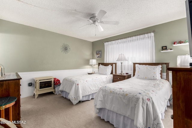 1379 W Camino Lucientes, Green Valley, AZ 85622 - bedroom featuring a textured ceiling, baseboards, a ceiling fan, and wood finished floors