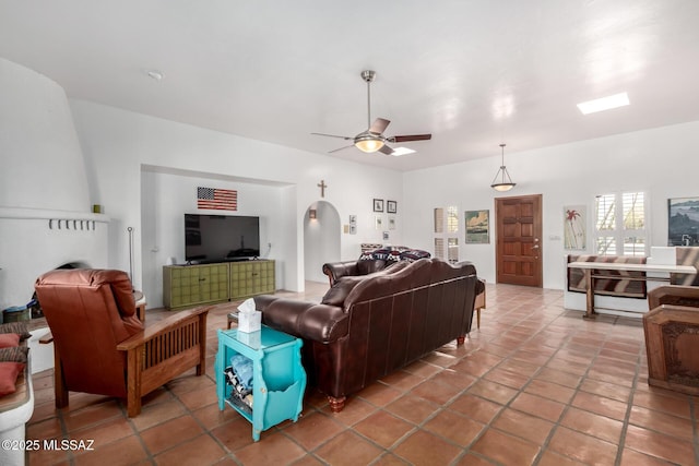 tiled living area featuring ceiling fan