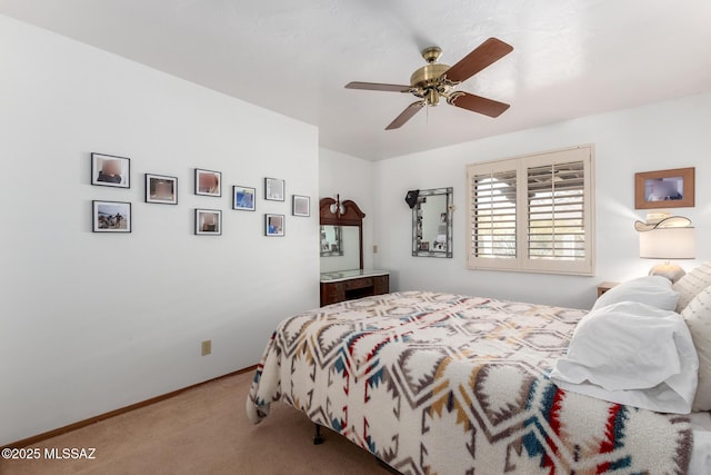 bedroom featuring baseboards, a ceiling fan, and carpet