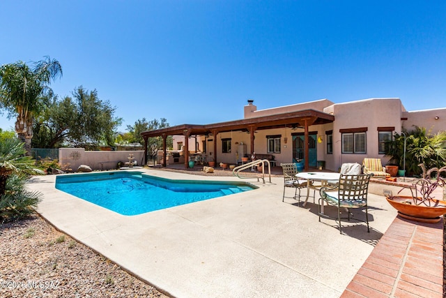 view of pool featuring a fenced in pool, a patio, fence, and ceiling fan