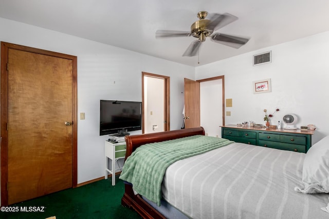 carpeted bedroom with visible vents and a ceiling fan